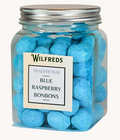 A clear jar filled with blue raspberry bonbons, with a label on the front that reads 'Wilfreds Traditional Blue Raspberry Bonbons'.