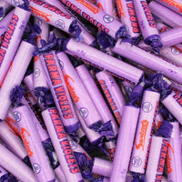 Stack of Parma Violets candy bars with purple and white wrappers.