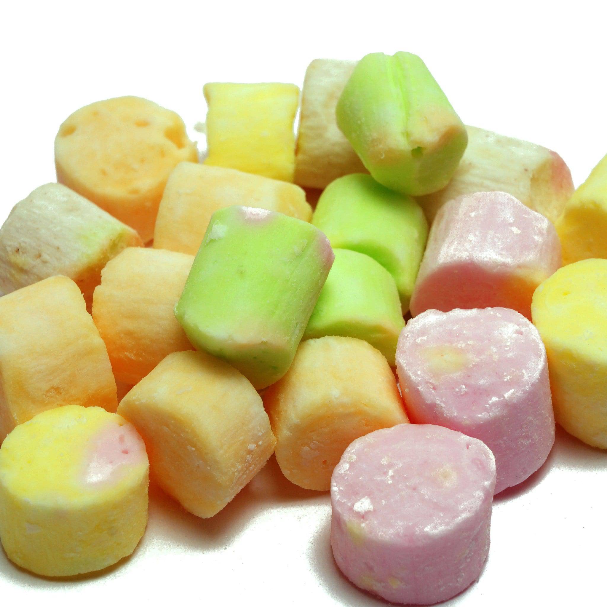 A variety of colorful candy pieces, some resembling rocks, with assorted fruit flavors.